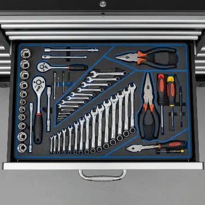 Organized steel tool chest interior with drawer liners and neatly arranged tools